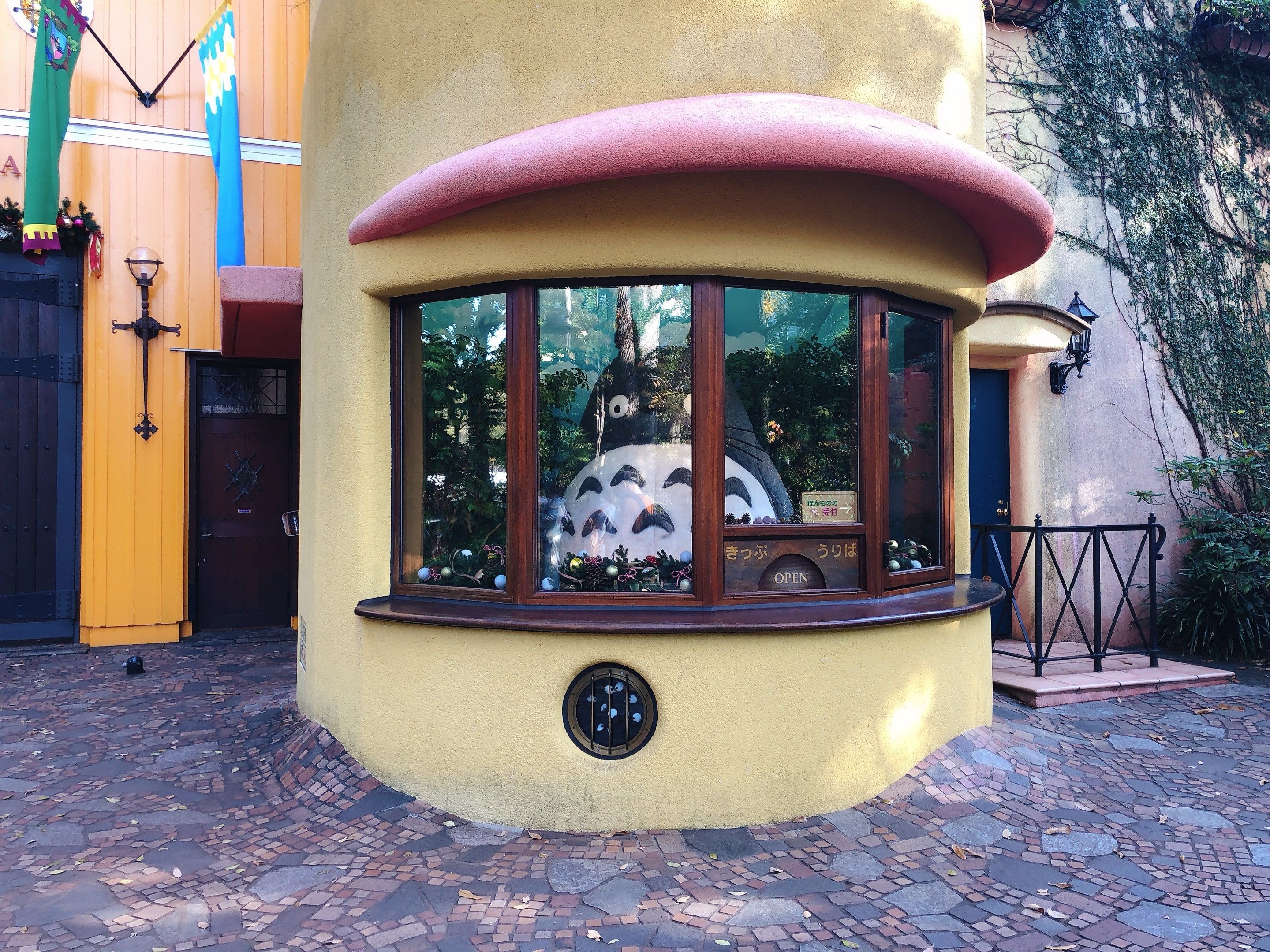 Totoro is standing at the reception with Dust Bunnies