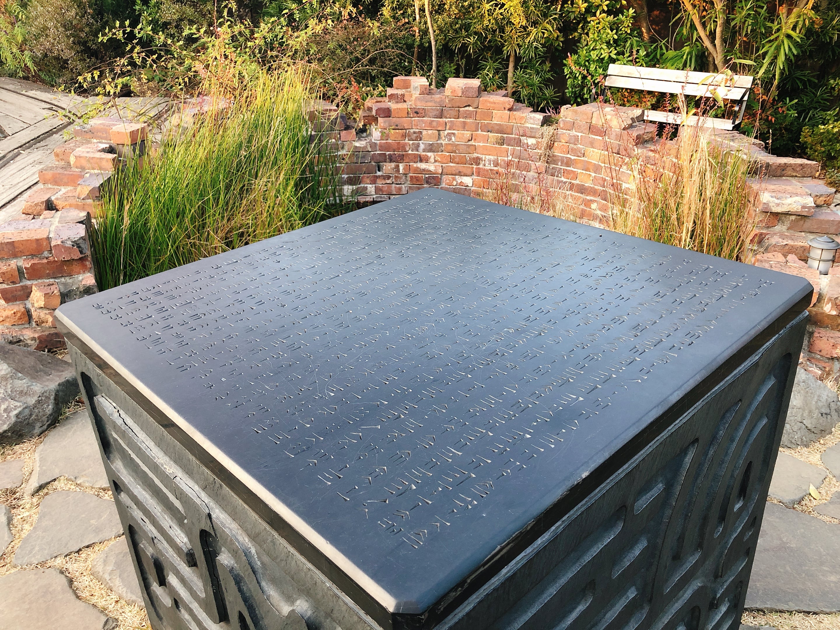 A stone monument on the rooftop garden of Ghibli Museum