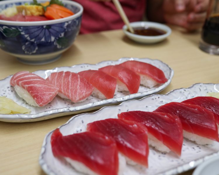 Several pieces of tuna sushi