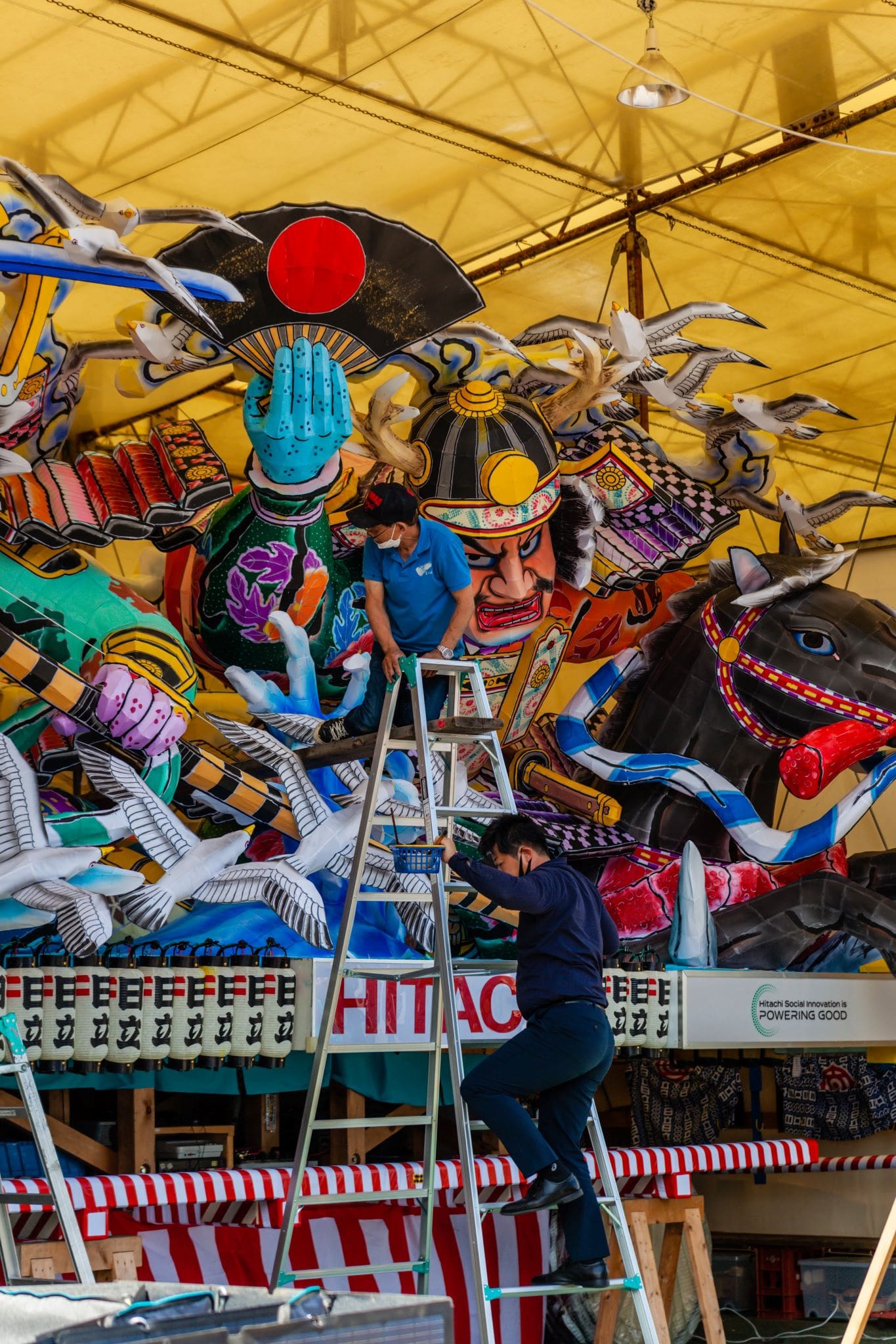 Nebuta floats on temporary warehouses while awaiting for the parade